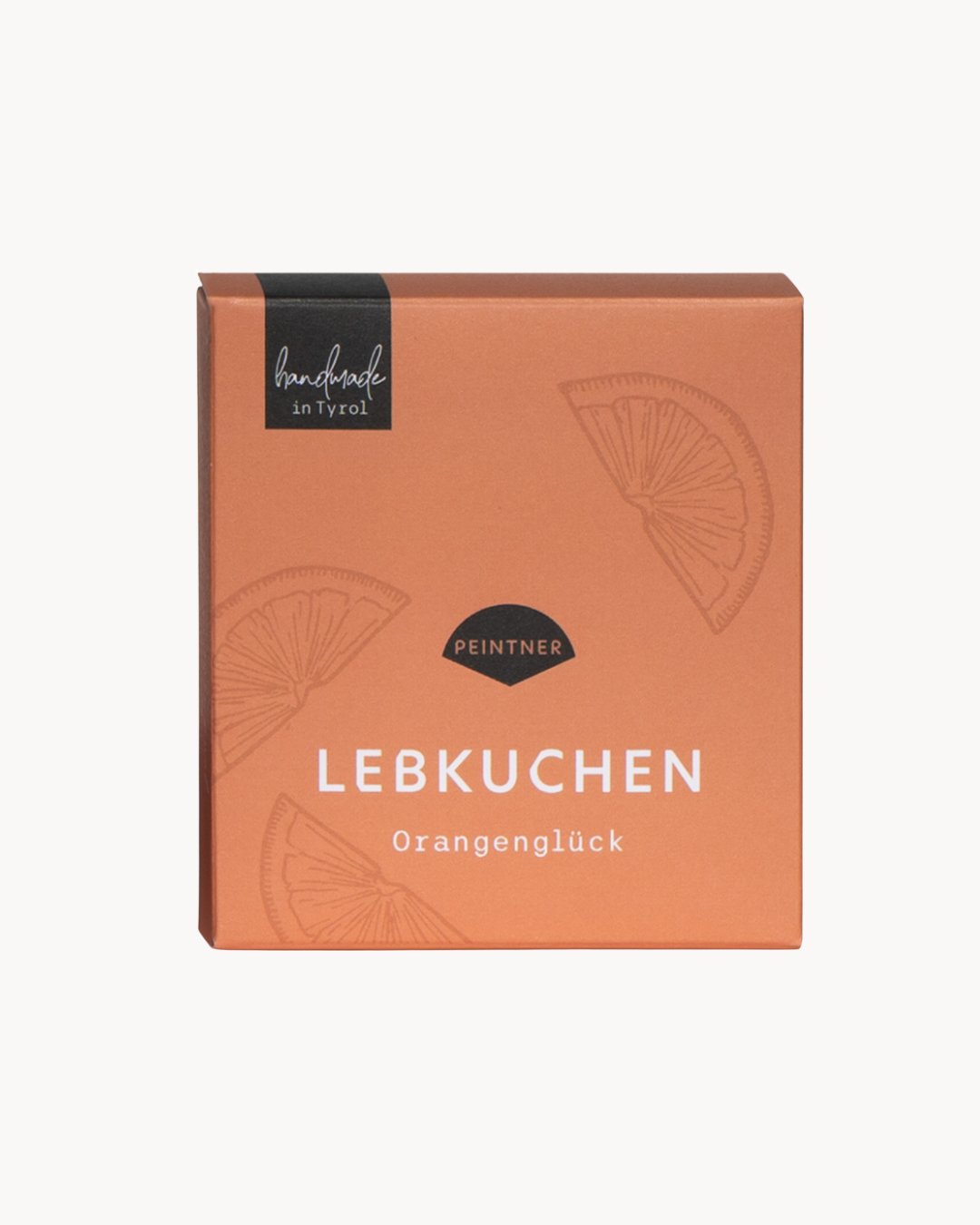 Lebkuchen: orangene Verpackung mit Orangenschreiben-Zeichnungen und der Aufschrift „Lebkuchen Orangenglück“ von Peintner, handmade in Tyrol.