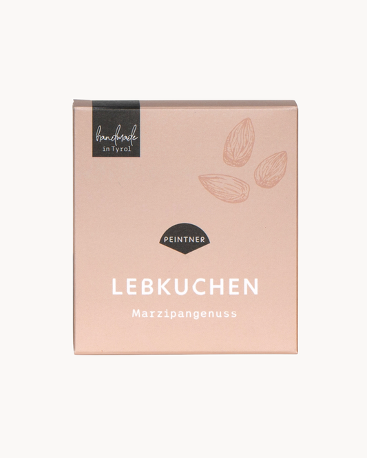 Lebkuchen: beige Verpackung mit Mandel-Zeichnungen und der Aufschrift „Lebkuchen Marzipangenuss“ von Peintner, handmade in Tyrol.