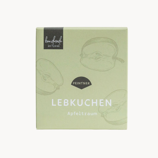 Lebkuchen: Grün-beige Verpackung mit Apfelzeichnungen und der Aufschrift „Lebkuchen Apfeltraum“ von Peintner, handmade in Tyrol.